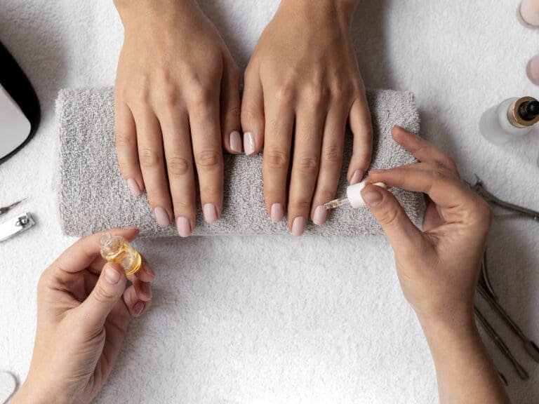 close-up-hand-holding-nail-product